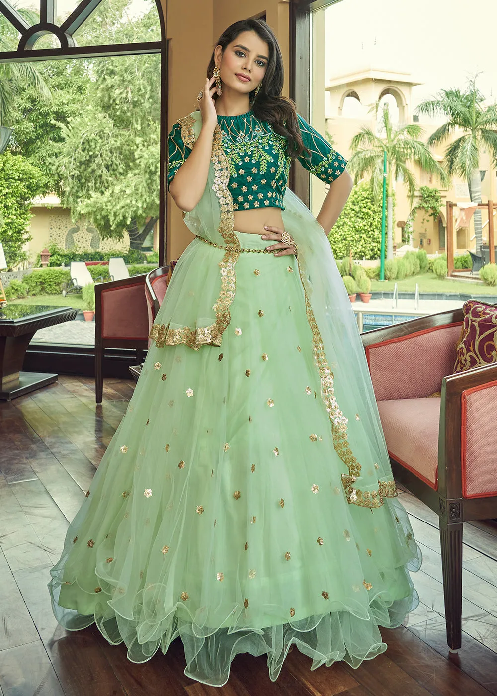 Glamorous Pista Green Heavy Net Party Wear Lehenga Choli