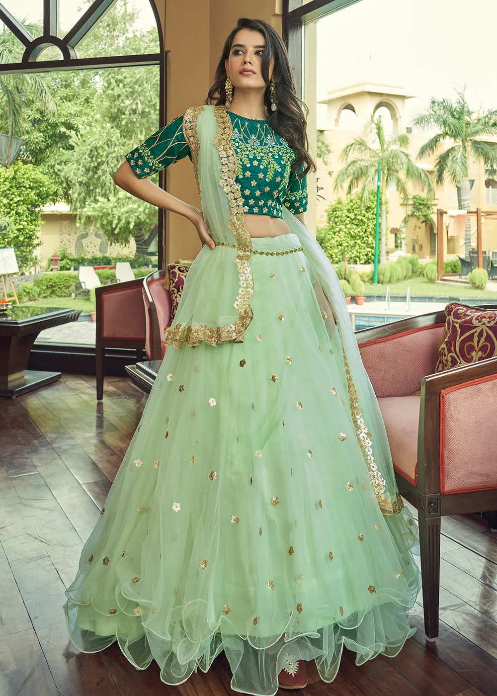 Glamorous Pista Green Heavy Net Party Wear Lehenga Choli